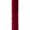 Lipstick tube with a burgundy velvet finish standing upright on a white background.